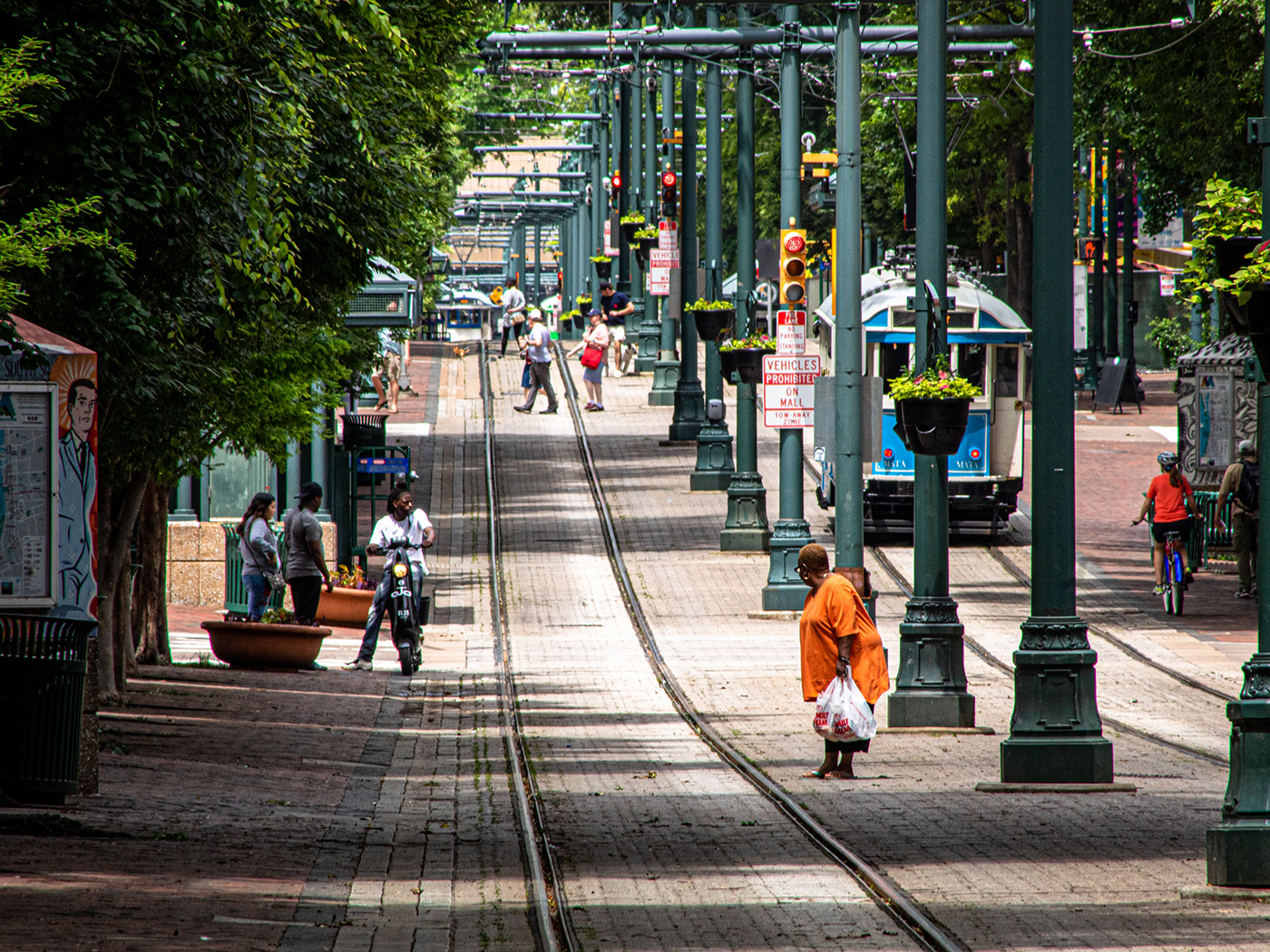 A woman checks the tracks before crossing over them in downtown Memphis, TN.