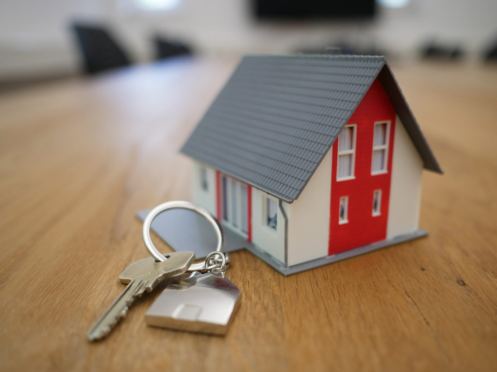 Picture of home and keys to symbolize a new home bought.
